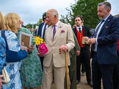 Their Majesties meet designer of RNLI lifeguard garden at RHS Sandringham Flower Show