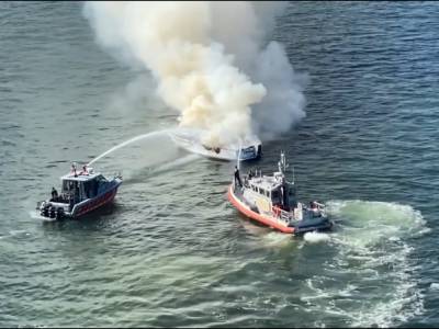 VIDEO: 2 men rescued from burning boat in Tampa Bay