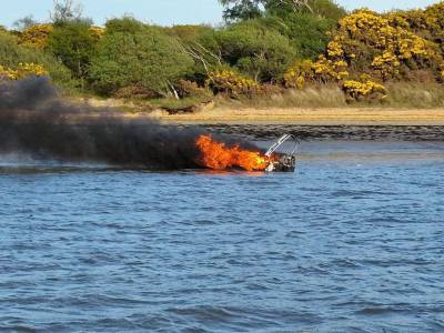 ‘I didn’t know what was going to explode’: watch as RNLI rescues family from blazing boat