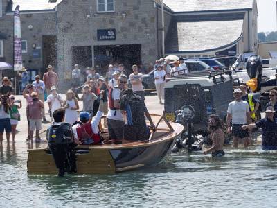 Graduates of the Boat Building Academy launch their new boats on hottest June day ever