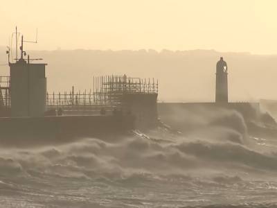 In pictures: Storm Eunice batters UK with record winds